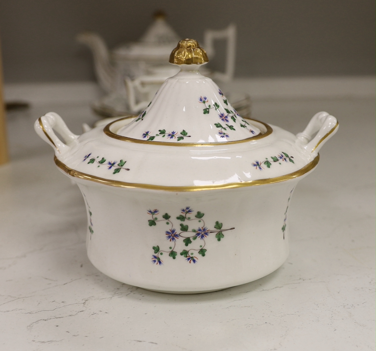 A Victorian bone china part teaset, painted with flowers, the largest 27cm wide